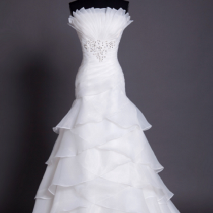 Mermaid Wedding Dress Featuring Tiered Ruffles And..
